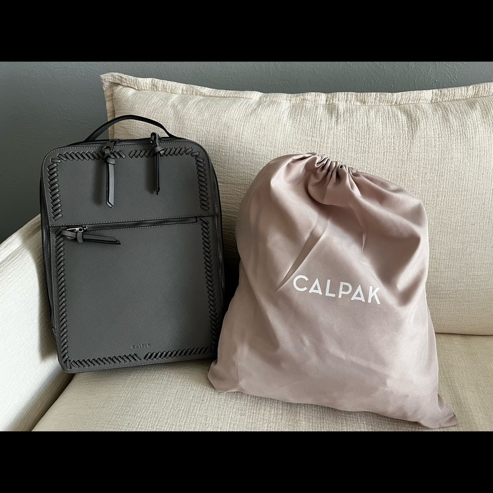 CALPAK grey backpack.  Pink inside.  Work/school/travel CALPAK with mult zippers
